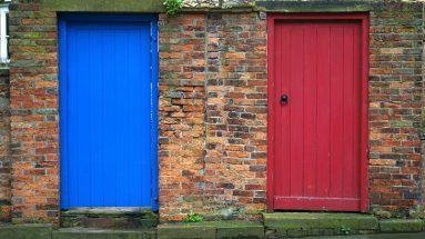 closed blue and red wooden doors